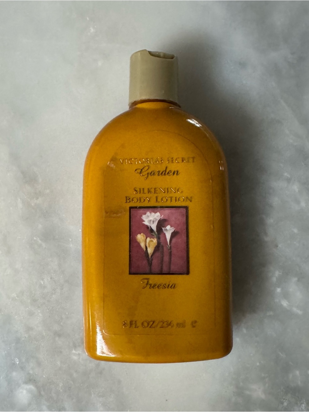 Victoria's Secret Garden Collection Freesia Silkening Body Lotion in an 8 fl oz